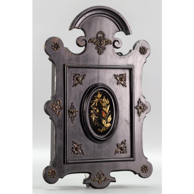 Antique Louis Philippe style black wooden wall hanging key cabinet, ca 1890. An ornate wall-hanging key cabinet with...