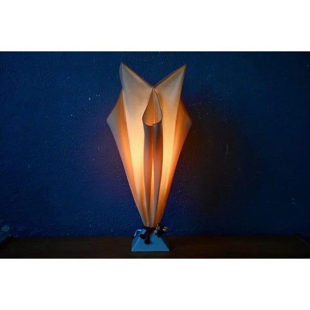 Inspired by the shape of a fiery torch, this exuberant luminaire from the 90s offers a fireworks of colors and shapes. The...