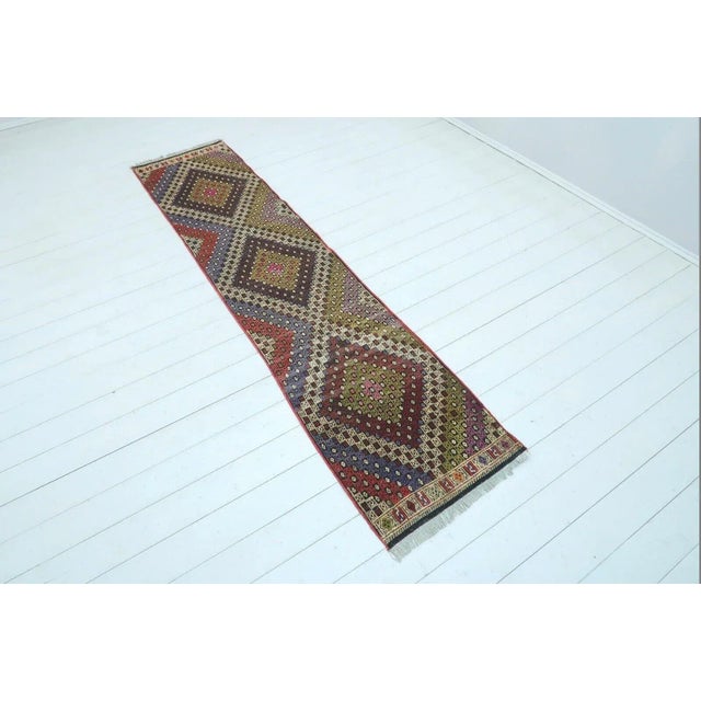 This beautiful, traditional vintage, hand knotted Turkish runner is approximately 60 years old. It is handmade of very...