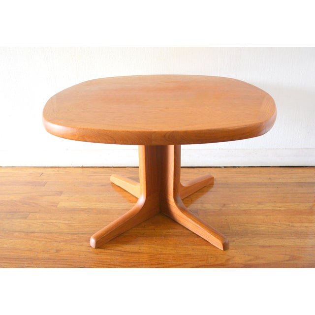 This is a Mid Century Scandinavian style teak coffee table by Nordic Furniture. It has a beautiful wood grain with parquet...