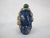 Antique Chinese snuff bottle in lapis lazuli showing carved flowers and leaves. Double gourd shaped body with green...