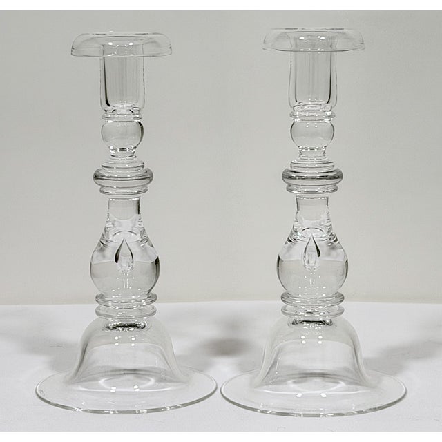These are vintage candlesticks designed in 1937 by F.B. Sellew and manufactured by the famous Steuben Glass Co. in...