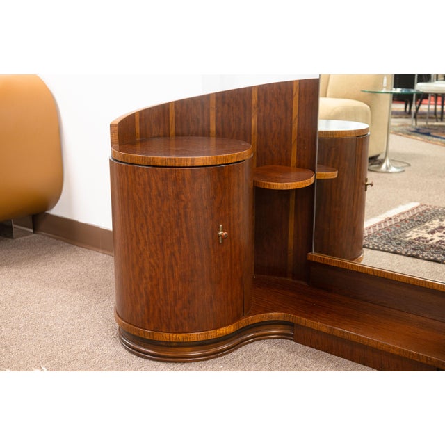 A vintage art deco vanity set. This lovely modernist vanity set features a large vertical rectangular mirror and ample...