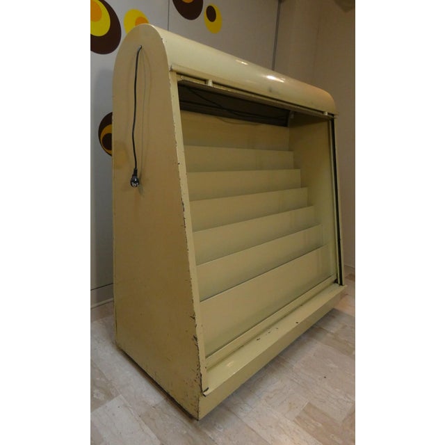 This 1960s-era piece of furniture was used by a newsstand at milan central station to display magazines and newspapers....