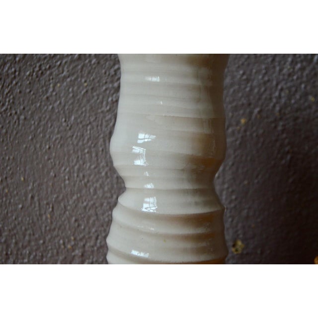 I absolutely love this glazed stoneware vase with its primitive totem-like appearance. Its slender silhouette and...
