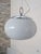 Beautiful pendant lamp by Mazzega. Italy, 1970s. Chrome-plated metal frame. It supports a large frosted, hand-blown Murano...