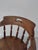 A Captains Chair made in Elm and Ash. Quite the rare model with 11 spindles, twin front stretcher rails, butlers grasp and...