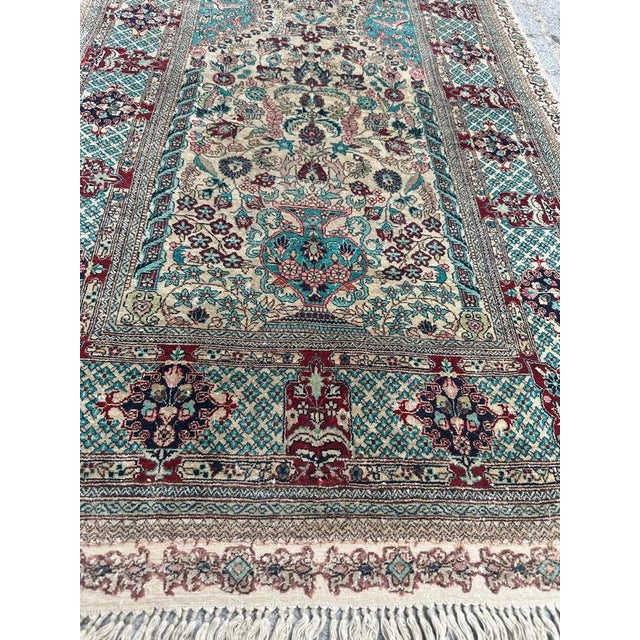 Introducing an exquisite late 20th-century silk rug that truly captivates with its intricate design. Adorned with splendid...