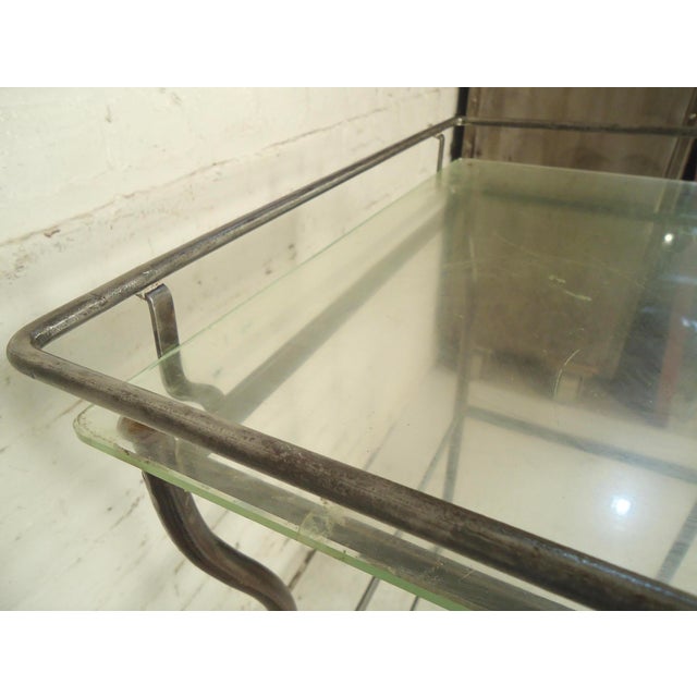 Metal table with glass top. Refinished in a bare metal style finish. (Please confirm item location - NY or NJ - with dealer)