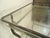 Metal table with glass top. Refinished in a bare metal style finish. (Please confirm item location - NY or NJ - with dealer)