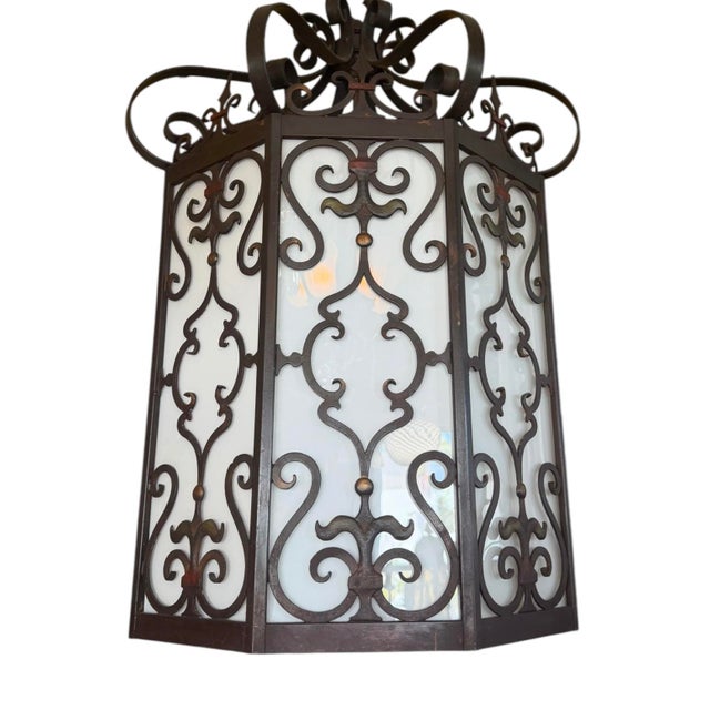 A fabulous very large light fixture! This Spanish Revival lantern features an octagonal iron frame with intricate...