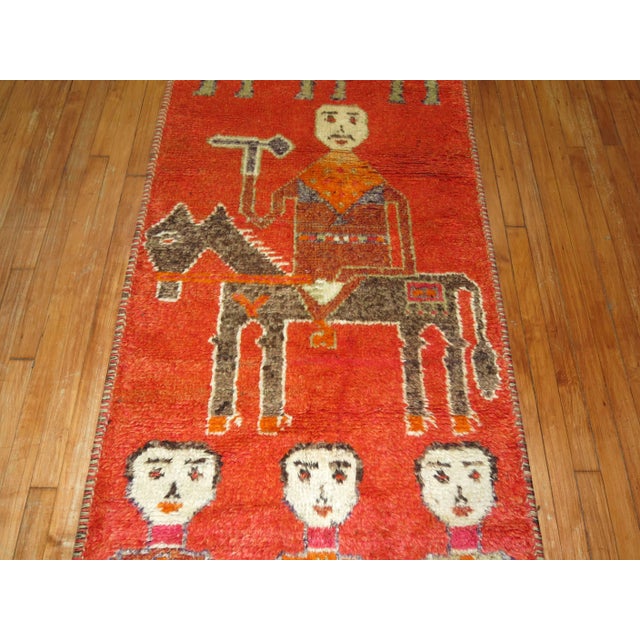 Rare Persian runner depicting three men and women in between a mustached gentleman sitting on his horse. 3'1'' x 10'3''