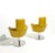 Set of two swivel armchairs. Anatomically shaped leather/faux leather upholstery with chromed steel legs. Labeled by the...