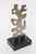 This vintage modernist cubist style steel metal sculpture sits on a black veined marble base that is original. It is...