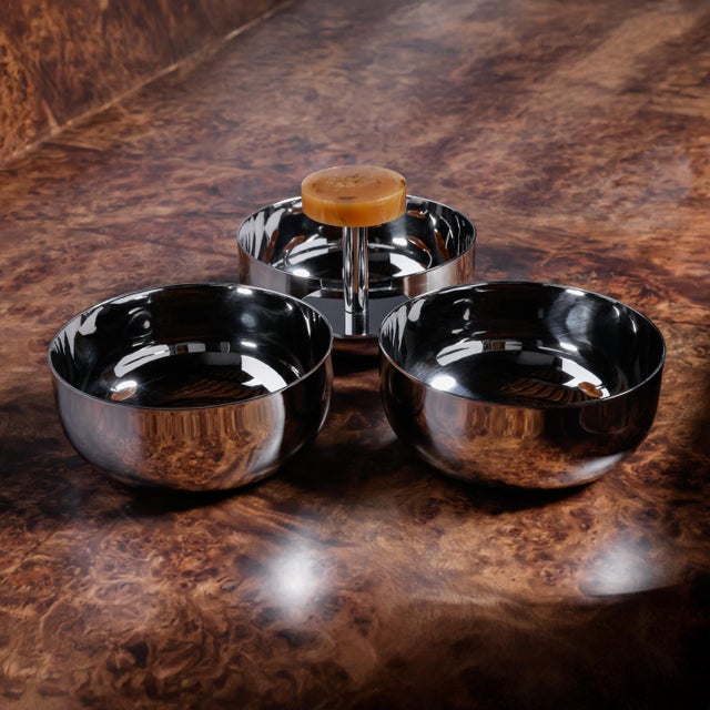 This three-cup condiment set combines functionality and style. Made from polished stainless steel, the set features round...