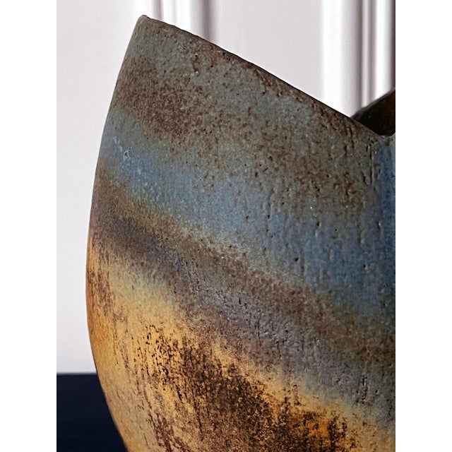 A stoneware vessel with glazed and banded stripes design by British studio ceramist John Ward (1938-2023) circa 1980s. The...