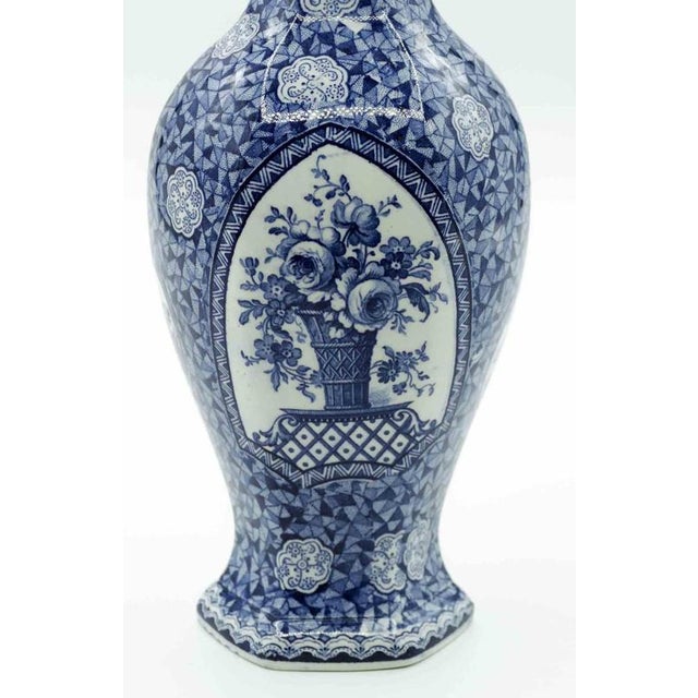 Ceramic blue vase is an original decorative object realized in 19th century by Franz Anton Mehlem. Elegant vase with...