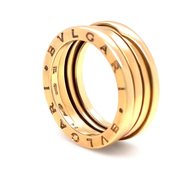 A bold and iconic Bvlgari B.Zero1 three-band ring crafted in 18ct yellow gold, inspired by the architectural lines of the...