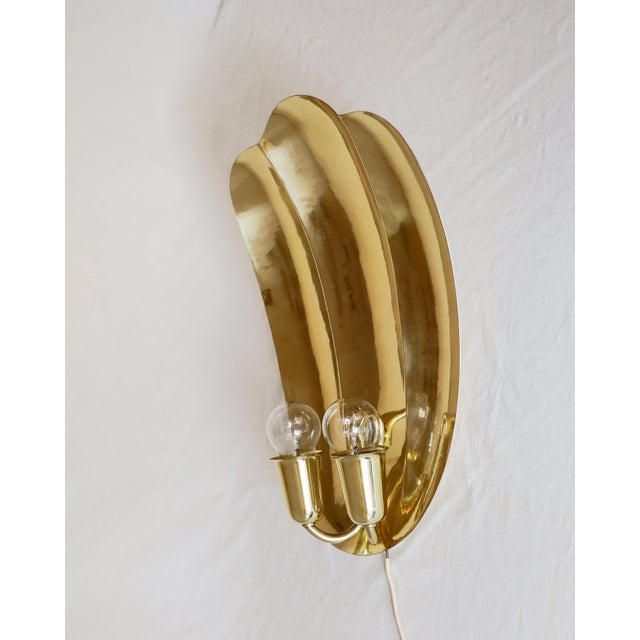Art Deco Wall Lamp Art Deco brass wall lamp, made in the 1920s/30s. Large shell-shaped design. The lamp has been...