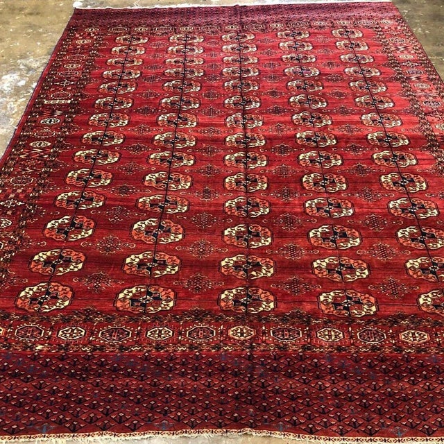 A Classic Antique Turkoman Tekke Rug This striking antique Turkmen Tekke rug was hand-knotted approximately 100 years ago...