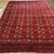 A Classic Antique Turkoman Tekke Rug This striking antique Turkmen Tekke rug was hand-knotted approximately 100 years ago...