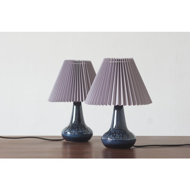 A striking pair of Søholm Stentøj ceramic table lamps from Denmark, designed in the distinctive aesthetic of 1960s...