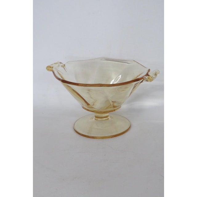 This lovely Pedestal Footed Bowl is made of depression glass. This beautiful bowl has a wonderful yellow color to the...