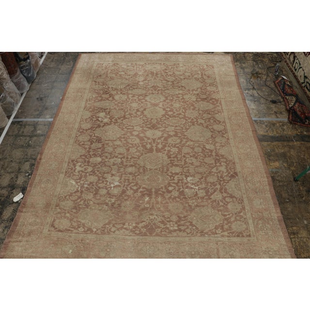 Hand-knotted in wool circa 1910-1920, this 10x14 antique Afghanistan rug is believed to be a Mahal rug—a renowned work...