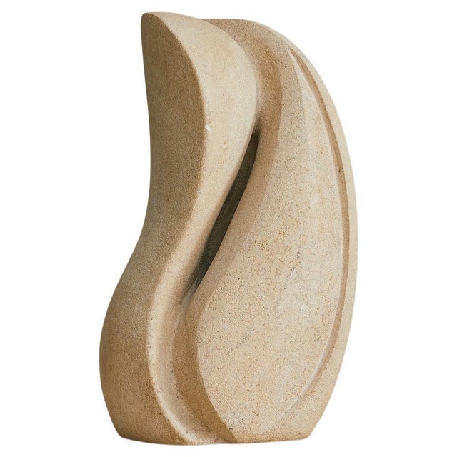 A sculptural table lamp by French artisan Albert Tormos, hand-carved from solid limestone in the 1970s. The abstract form...