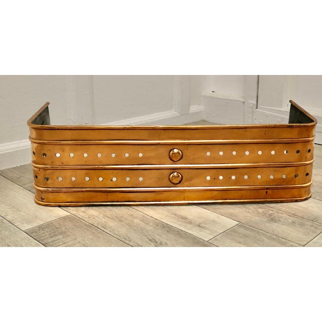 Victorian Art and Crafts copper fender. This is a beautifully designed Victorian brass fender it is decorated with...