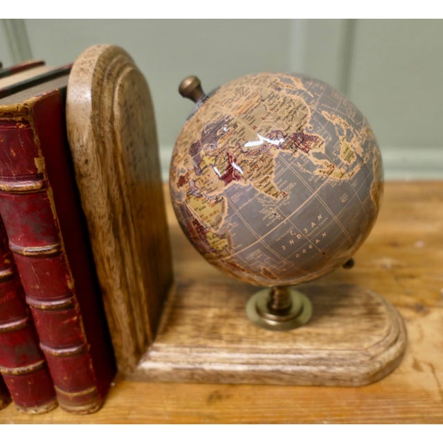 A Set of Bookends for the Geography Student A very attractive pair and clever design, the ends are made with small globes...