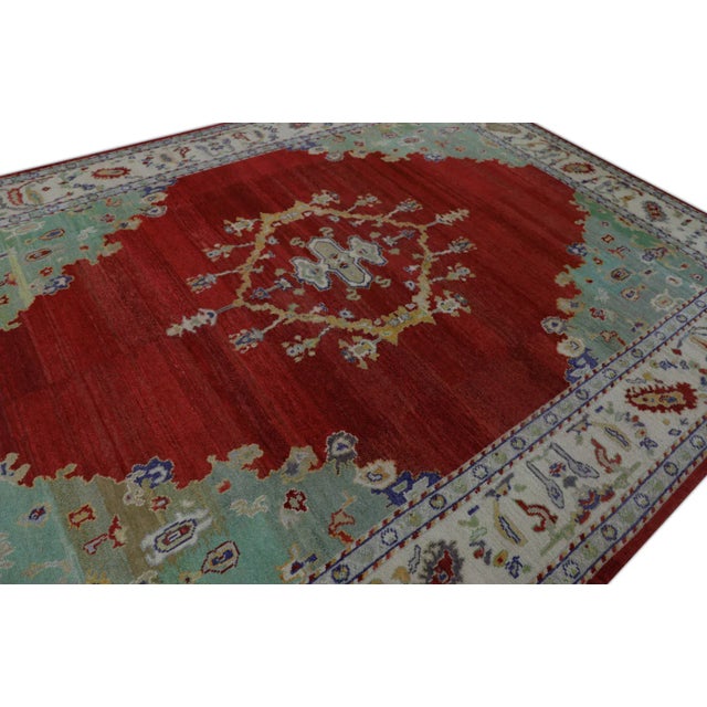 This modern Turkish Oushak rug made from reclaimed vintage wool is a stunning piece of art that has been handwoven using...