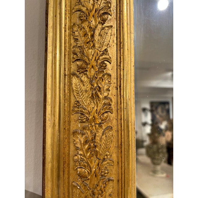 An impressive pair of 18th-century French Restoration period floor mirrors featuring elegant proportions, finely crafted...