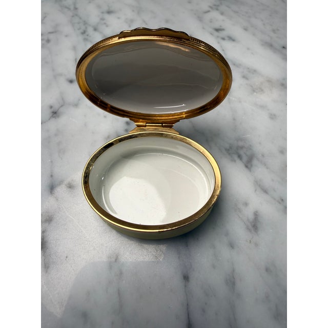 A charming vintage enamel keepsake box by Halcyon Days, designed for Tiffany & Co., beautifully finished in soft celadon-...