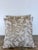 A refined pair of custom square pillows rendered in a luminous linen. The face features an elegant botanical study of...
