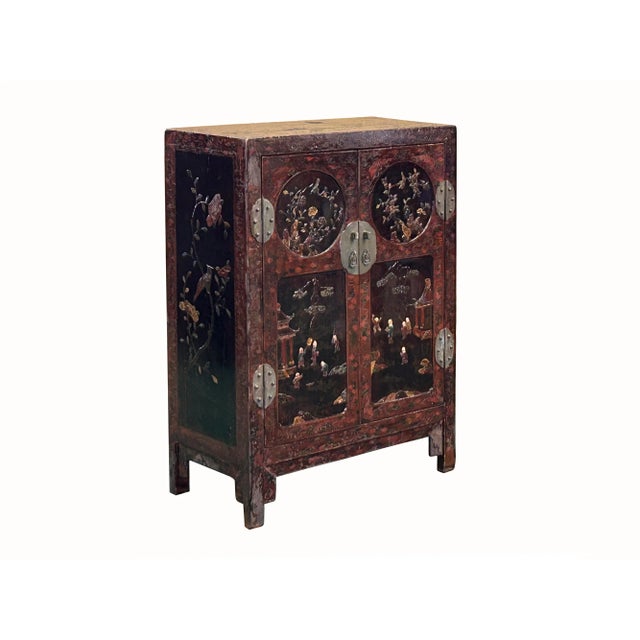 The Vintage Chinoiseries Brick Red & Stone Inlay Graphic Credenza Cabinet is a striking and unique furniture piece that...