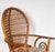 A Rattan and Bamboo Breakfast Table and Two Chairs the table with glass top, 29 1/4 x 48 in., the chairs each 44 x 26 1/2...
