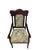 Elegant mahogany-finished armchair featuring a shaped crest rail with carved fan and scroll motifs inspired by late...