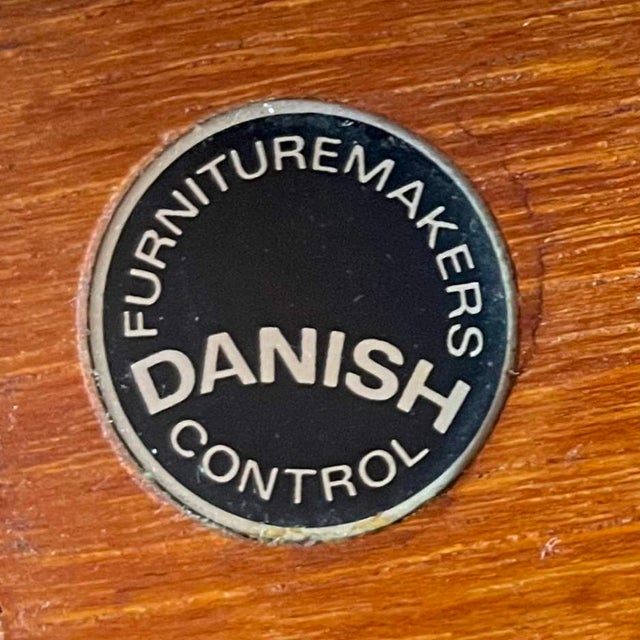 A single Danish teak dining chair designed in 1964 by Hugo Frandsen for Børge M Søndergaard. In excellent original...