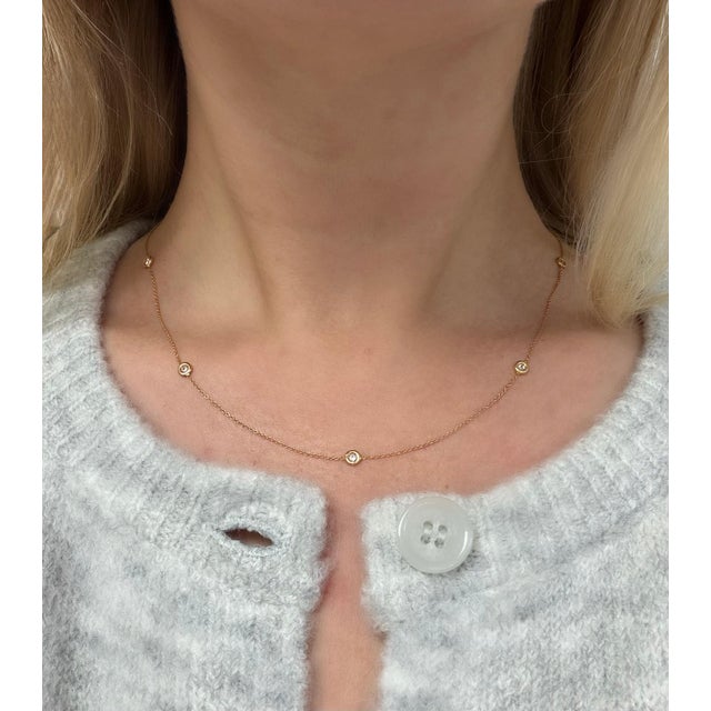 This gorgeous necklace by Italian designer Roberto Coin contains five round brilliant cut stations weighing approximately...