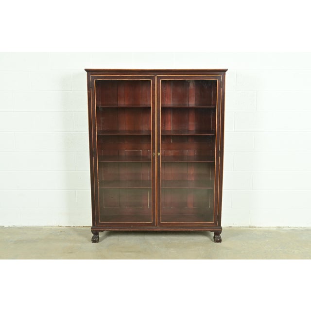 A gorgeous antique American Empire or Victorian bookcase cabinet In the manner of R.J. Horner & Co. USA, Circa 1890s...