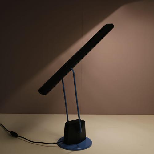 A modern, adjustable desk lamp made in Italy around 1980. Made of high quality black lacquered metal with tubular blue...