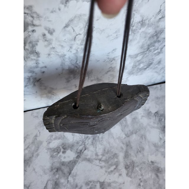 Artisan carved and decorative wind chime with a deep glaze and sgraffito style technique. A beautiful piece for inside...