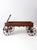 This is an antique primitive wooden wagon, featuring a classic design with a rectangular body, four spoke wheels, and a...