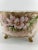 D&Co, Limoges, France hand-painted porcelain bowl, featuring apple blossoms with leaves in pale pink and green tones....