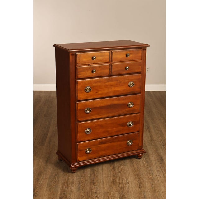 Classic Tall Chest Dresser by Broyhill, Crafted in Warm-Toned Wood with a Clean Traditional Profile. The Case Features Two...