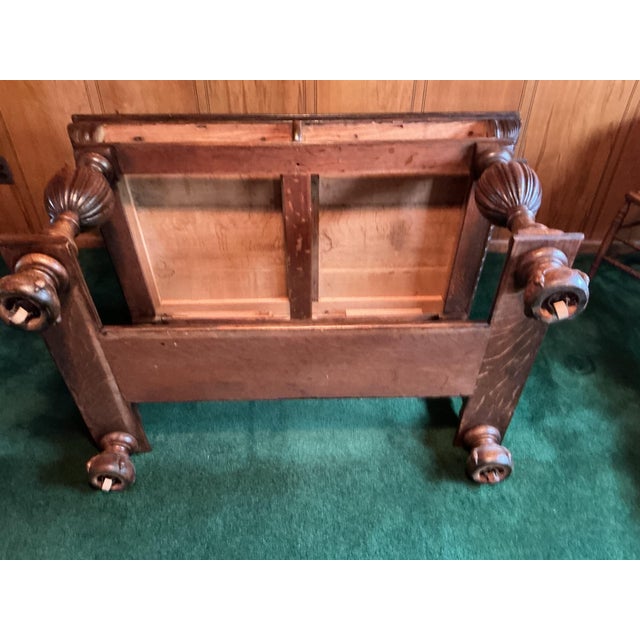 This handsome antique oak writing table embodies the bold, architectural carved lines. Crafted from solid quarter-sawn oak...
