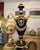This grand Sevres-style porcelain vase is an elegant statement piece finished in rich midnight blue tones that become even...