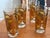 Set of 4 vintage mid-century modern highball glasses by Culver Ltd., featuring an intricate 22k gold and textured...
