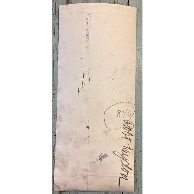 1934 photograph of a tennis player holding his racket. "Robert Heydon" is written on the back.